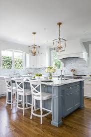 For example, when the island was painted gray, it only took one coat. White Kitchen With Stacked Cabinets And Grey Island Home Bunch Interior Design Ideas