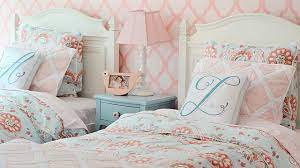 For more shared bedroom ideas for a brother and sister, notice how the neutral walls here can work with many different styles, allowing each kid to express their personality through accessories of their choosing. From Nursery To Big Girl Room For Two Sisters Youtube