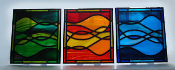 A stained glass window panel depicting a coat of arms, featuring a crown, elephant, song birds and clover. Modern Stained Glass Art Doors Windows Framed Mounted Giftsviv Wilkins Glassart