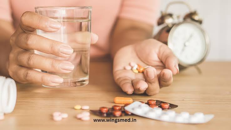 Person holding a glass of water alongside medication, reflecting on how medicine can feel different from one day to the next