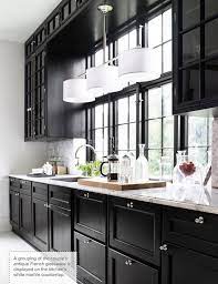 The marble herringbone tile backsplash lends pattern. Confetti And Stripes Black Kitchen Cabinets Kitchen Design Kitchen Trends Kitchen Cabinet Design