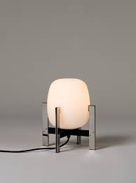 The cesta table lamp is an excellent decorative object, perfect for placing on a table or resting on the floor, and the light can be dimmed according to preference. Cesta Table Lamps Santa Cole