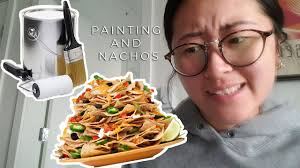 Wine and Paint Night but it's us making nachos and painting a wall