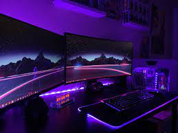 This is a great gaming desk that will hold up to three monitors, your consoles, and still have room to spare. Purple And Green Gaming Room Novocom Top