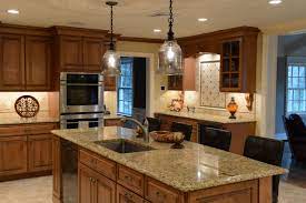 Designers often recommend choosing dark granite with stainless steel appliances and maple cabinets, avoiding tan or gold granite because it clashes with maple's brown tones. Granite Countertops Maple Cabinets Houzz