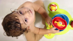 A battery operated bath spout that easily attaches and draws water. Stack N Spray Tub Fountain Baby Bath Toys Yookidoo