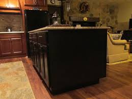 Amboy, mn kitchen, holiday kitchens cabinets, lifetime warranty, new castle doors style and drawer fronts, decorator end panels, 9' ceilings with wall cabinets to ceiling and crown molding, custom cherry hood, island and baking area, newels at the cook top, island, sink base and peninsula end. Need Help Decorating Plain Kitchen Island End Panels