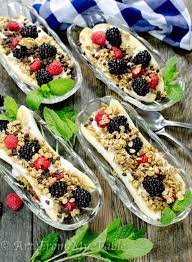 Bananas cut in half 1/2 cup greek yogurt to each almond slices granola dried coconut blueberries raspberries blackberries lily's chocolate chips. Breakfast Banana Split Art From My Table