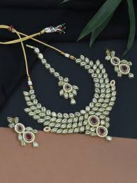 Even cultured pearls with thicker coatings are more fragile than most other gemstones, so you must handle them carefully to keep them in the best condition. Gold Plated American Diamond Kundan Bridal Jewellery Set For Women