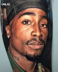 This tattoo specifically symbolized black unity. Unilad Incredible Hyper Realistic 2pac Tattoo Facebook