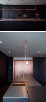 Black And Copper Kitchen Design In This Modern Kitchen Black Cabinetry Is Paired With Copper Details Like Wall Panels Rustic Kitchen Design Modern Black Kitchen Interior Design Kitchen Small
