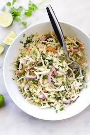 Whisk together half the olive oil, lime juice, garlic and taco seasoning. Easy Mexican Coleslaw Recipe Foodiecrush Com