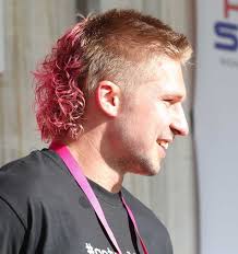 All Black Jack Goodhue's mullet dyed pink and permed at Mullet in the Park 