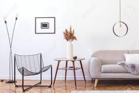 Amazing gallery of interior design and decorating ideas of charcoal gray sofa in living rooms by elite interior designers. Stylish Minimalistic Living Room With Design Grey Sofa Black Stock Photo Picture And Royalty Free Image Image 122962614