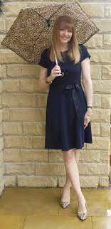 Sheer black hose / stockings would be dressier than black tights. Outfit Little Navy Dress Leopard Shoes And Striped Trench What Lizzy Loves