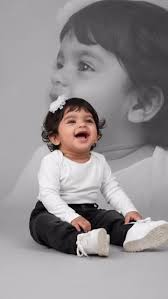 Double Exposure Portrait with Smiling Baby & Monochromatic Background
