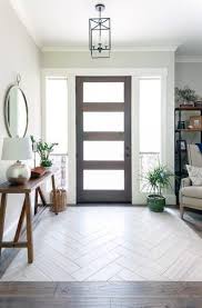 This entryway table maintains an open and airy decor thanks to its simplistic design. Top 50 Best Entryway Tile Ideas Foyer Designs