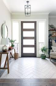 This entryway table maintains an open and airy decor thanks to its simplistic design. Top 50 Best Entryway Tile Ideas Foyer Designs