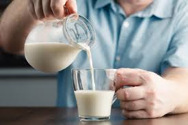 Close Up Of Man Hand Pouring Milk From Jug To Glass On A Rustic Wooden Table Paid Ad Ad Pouring In 2020 Heavy Cream Substitute Heavy Cream Recipes Heavy Cream