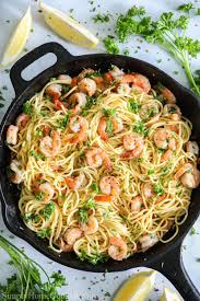 This Garlic Shrimp Scampi Pasta Is Made With Pan Seared Shrimp Red Pepper Flakes And A Lemony Wine Sauce Scampi Pasta Shrimp Scampi Pasta Shrimp Pasta Dishes