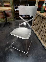 32.25 h x 16.5 w x 17 d. Metal Silver Chair With X Back Has A Modern Industrial Charm