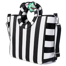 The man in black is looking for a rare bone; Beetlejuice Sandworm Handle Crossbody Purse