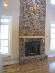 Cultured rock runs top to bottom, accenting the height of the vaulted ceiling. Stacked Stone Veneer Stacked Stone Fireplaces Stone Veneer Fireplace Stone Fireplace Surround