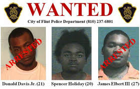 Two people arrested, one still at large in shooting death of 22-year-old