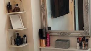 The middle object grounds the display. Small Bedroom Corner Turned Into Dressing Table Makeup Area With Shelving And Creative Thinking