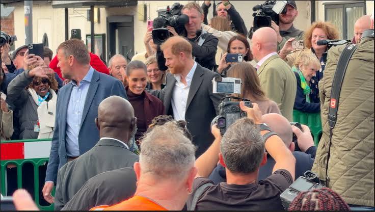 Prince Harry and Meghan Markle greet crowds as they leave recording studio in Nottingham