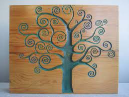 This beautiful twisting tree has been burnt into a unique piece of salvaged wood with a process known as pyrography. Tree Swirl Wood Carved Art Wall Hanging Etsy Wood Carving Art Hanging Wall Art Wood Art