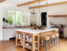 Don't forget the ends of the island, where a few shallow shelves can house anything from your prized pottery sleek barstools and a streamlined kitchen island on wheels fit beautifully in this small but open floor plan. Kitchen Island With Wine Rack Large White Subway Tile Backsplash And Black Drawer Knobs