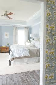 Guest Bedroom White Washed Wood Floors Floral Wallpaper Blue Walls Tray Ceiling Large Area Light Blue Bedroom Light Blue Living Room Bedroom Paint Colors