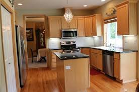 Snow white granite is a beautiful white granite that contains gray veins. Kitchen Help Oak Cabinets And Black Counters