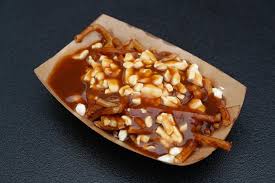 Upon the customer requesting for some cheese to be added to his fries, the owner exclaims ça va faire une maudite poutine! or, that's going to make a dreadful mess. De La Vraie Poutine Du Quebec En France La Presse