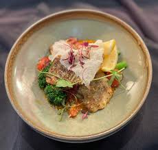 AMISFIELD RESTAURANT & CELLAR DOOR Planning a trip to Queenstown? Amisfield Restaurant & Cellar Door has launched an à la carte lunch menu that's centered around cooking over a new courtyard fire