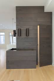 A Dark Wood Panel Accent Wall Was Installed To Separate The Kitchen From The Entertainment Room We Took Hidden Doors In Walls Wall Paneling Wall Tiles Design