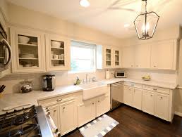 Cream Cabinets Transitional Kitchen Cote De Texas Cream Cabinets U Shaped Kitchen Kitchen Design