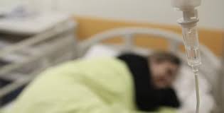 Sick Woman Lays In A Hospital Bed by Xenon54 | VideoHive