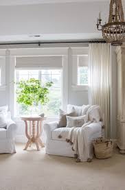 Besides living areas, these can also be used in bedrooms. Bedroom Sitting Area With White Chairs And Wood Bead Chandelier Saw Nail And Paint