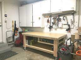 It has a large worktop and bottom shelf and is on wheels so you can take it wherever it needs to go. How To Build The Ultimate Diy Garage Workbench Free Plans