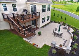 Spread a layer of sand. Combine Paver Patio And Deck For The Best In Outdoor Living Marvin S Brick Pavers