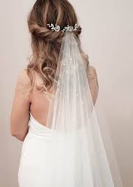 Putting flowers in your hair is a timeless look that is elegant and unique. Delicate Bridal Hair Pins For The Modern Bride Tania Maras Bespoke Wedding Headpieces Wedding Veils