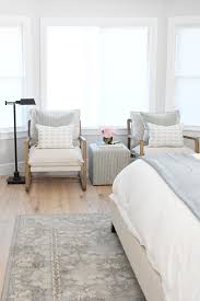 Interior of a large modern bedroom with a fireplace and ceiling fan. Modern Master Bedroom Ideas Our Summer Home Tour Pink Peppermint Design