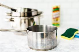 Make sure the pan is completely dry, and sprinkle baking soda onto the surface of the pan where the heat damage is located. Cleaning Stainless Steel Cookware