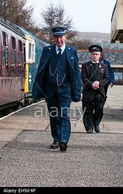 Stock Photo A Train Guard In A 1970s And 1980s Period British Rail Guards Uniform Walking Along The Platform At Rawten Rail Guard Stock Photos Train Pictures