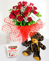 This beautiful hand made bouquet combines a scrumptious bottle of prosecco with delicious ferrero rocher and lindor chocolates, a 20cm teddy bear and silk flowers. 15 Red Roses Bouquet With Chocolate And A Teddy Bear