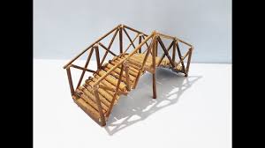 Pour pea gravel around the footings to provide a smooth gradual transition from the ground to the bridge walkway. How To Make Mini Wood Bridge For Fairy Gardens Diy Youtube