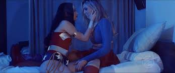 Supergirl wasnt feeling well so Wonder Woman checked in on her. Her kisses  made Supergirl feel so much better.