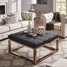 A good coffee table is a key component of any living room, but an ottoman coffee table takes style to a new level. Must Have Weston Home Libby Dimpled Tufted Cushion Ottoman Coffee Table With Champagne Gold Straight Base Dark Grey Linen From Weston Home Accuweather Shop
